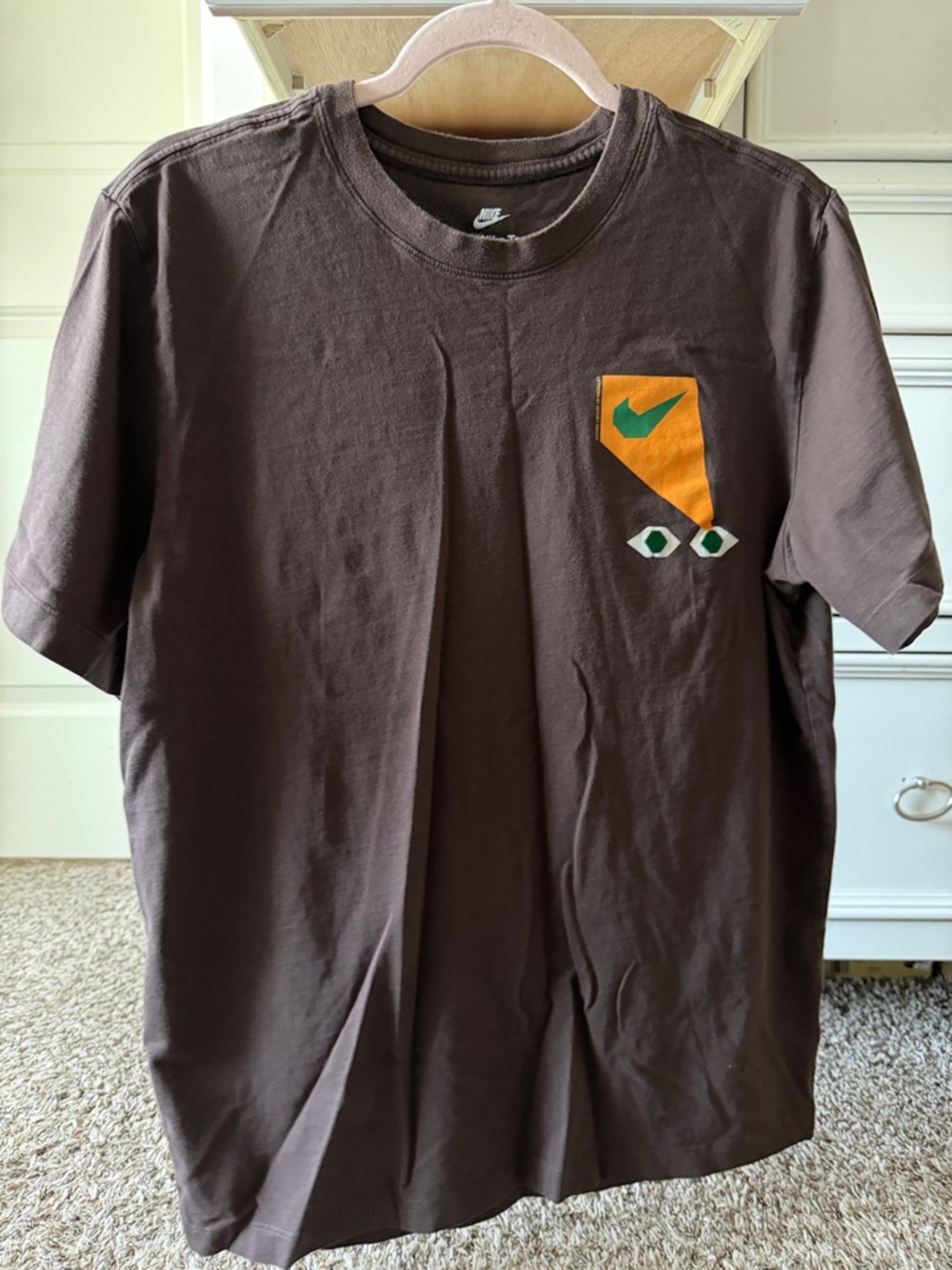 Nike Brown Short-Sleeve Tee with Orange Pocket and Green Swoosh